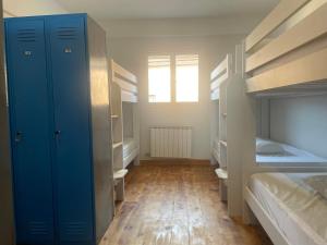 Postel nebo postele na pokoji v ubytování Las Hadas Albergue -solo para Peregrinos - Vegano -Bar
