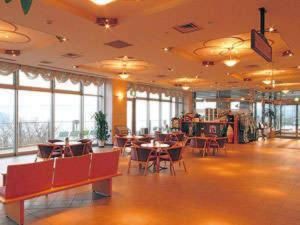 a large room with tables and chairs and windows at Kaikyo View SHIMONOSEKI - Vacation STAY 13686v in Shimonoseki
