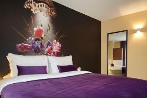 Postel nebo postele na pokoji v ubytování The Muse Amsterdam - Boutique Hotel