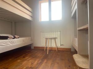 Postel nebo postele na pokoji v ubytování Las Hadas Albergue -solo para Peregrinos - Vegano -Bar