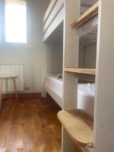 Postel nebo postele na pokoji v ubytování Las Hadas Albergue -solo para Peregrinos - Vegano -Bar
