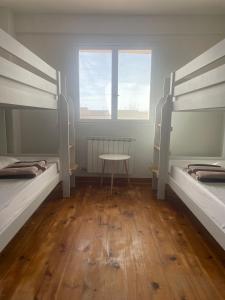 Postel nebo postele na pokoji v ubytování Las Hadas Albergue -solo para Peregrinos - Vegano -Bar