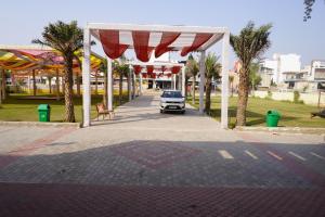 a car parked under a pavilion in a park at Khatu Bagh Resort in Sīkar