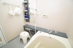 a bathroom with a white toilet and a sink at karuizawa villa Baum in miyota in Miyota +58 photos