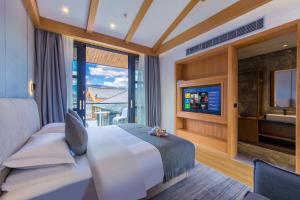 TV a/nebo společenská místnost v ubytování Yueyangli Garden Hotel