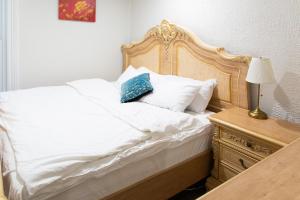 Ένα ή περισσότερα κρεβάτια σε δωμάτιο στο Downtown Apartment 6-7 people