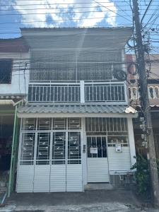 a house with white doors and a balcony at 7/7 House, Classic House for family in Hat Yai