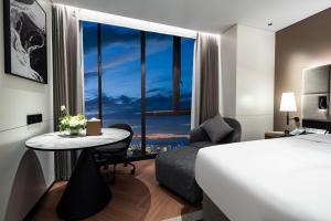 Ένα ή περισσότερα κρεβάτια σε δωμάτιο στο IntercityHotel Haikou Guoxing Avenue +16 φωτογραφίες
