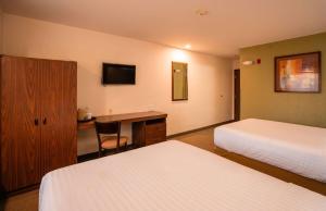 Postel nebo postele na pokoji v ubytování Microtel Inn and Suites by Wyndham Ciudad Juarez, US Consulate