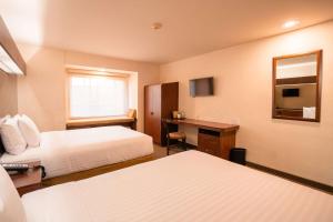 Postel nebo postele na pokoji v ubytování Microtel Inn and Suites by Wyndham Ciudad Juarez, US Consulate