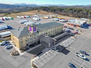 an aerial view of a building with a parking lot at Sleep Inn & Suites Cumberland in Cumberland