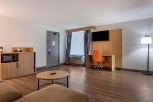 a living room with a couch and a table at Comfort Inn & Suites Nashville Downtown - Stadium in Nashville