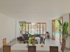a living room with a table and chairs at Red Mangrove in Bentota