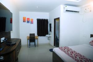 Ένα ή περισσότερα κρεβάτια σε δωμάτιο στο DR Dwell hotel