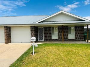 a house with a parking meter in the front yard at Cozy 2-Bedroom Retreat in Young