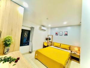 A bed or beds in a room at Luna House Hotel