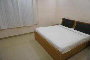 Postel nebo postele na pokoji v ubytování Hotel Bhanwar Niwas