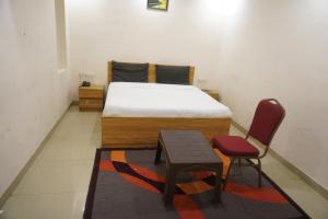 Postel nebo postele na pokoji v ubytování Hotel Bhanwar Niwas