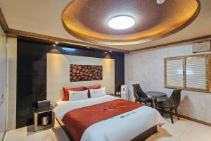 Posteľ alebo postele v izbe v ubytovaní Hotel Unity