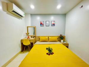 A bed or beds in a room at Luna House Hotel