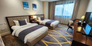 Lova arba lovos apgyvendinimo įstaigoje Sherao Hotel Doha فندق شراعوه الدوحة