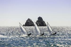 a group of three sailboats in the ocean at Le Ponton et son spa in Saint-Mandrier-sur-Mer