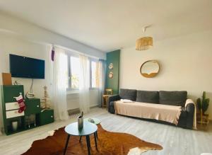 a living room with a couch and a table at La Cassy - Sleep in Cassis in Cassis