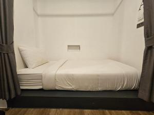 Postel nebo postele na pokoji v ubytování The Entaneer Poshtel