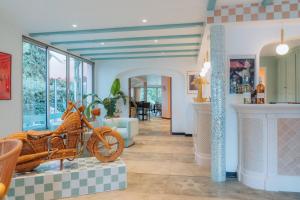 a house with a motorcycle on display in a room at Hollywood Hotel Cannes in Cannes