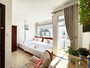 Postel nebo postele na pokoji v ubytování My My House Đà Lạt