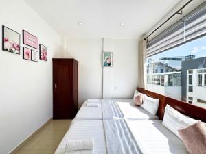 Postel nebo postele na pokoji v ubytování My My House Đà Lạt