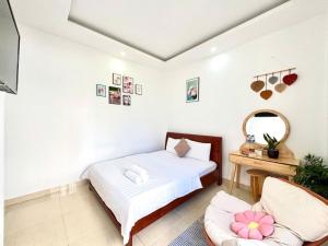 Postel nebo postele na pokoji v ubytování My My House Đà Lạt