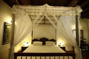 Ένα ή περισσότερα κρεβάτια σε δωμάτιο στο Palm Garden Village Hotel