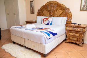 Postel nebo postele na pokoji v ubytování Seaview Executive Guest House + 153 fotografií