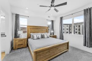 a bedroom with a bed and a ceiling fan at Sky Haven #202 condo in Hurricane