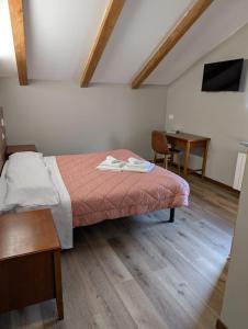 Voodi või voodid majutusasutuse Albergo Spina toas