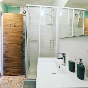 a bathroom with a sink and a shower at Maison cosy - Centre - Perche in Tourouvre