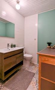 a bathroom with a sink and a toilet in it at Maison cosy - Centre - Perche in Tourouvre