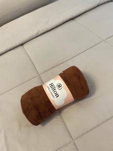 a brown sock on the floor with a band aid on it at Amyra Suite Kuantan in Kuantan