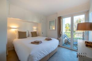 Posteľ alebo postele v izbe v ubytovaní Appartement prestigieux - Pied dans l'eau