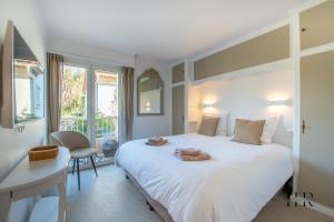 Posteľ alebo postele v izbe v ubytovaní Appartement prestigieux - Pied dans l'eau