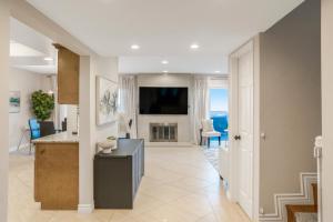 a kitchen and living room with a television and a living room at LUX Retreat - Best Views - All Amenities - Central in Lomita