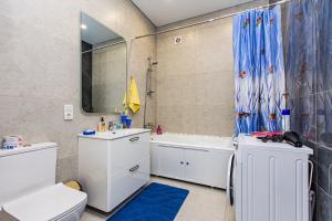 a bathroom with a toilet and a sink and a tub at Просторная 3х комнатная квартира в центре Алматы in Almaty +28 photos