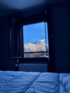 Ένα ή περισσότερα κρεβάτια σε δωμάτιο στο Le Hourmigué maison avec jacuzzi à 15mn de Luchon