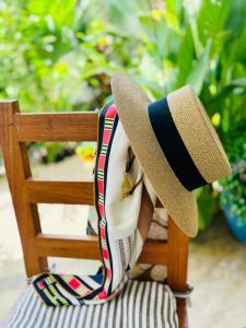 a hat sitting on top of a chair at Oasis Paje in Paje