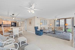 a living room with a dining room and a kitchen at Sunrise 109 in New Smyrna Beach