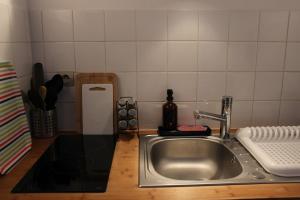 a kitchen counter with a sink in a kitchen at Studio 211 au cœur du campus de Belle Beille in Angers
