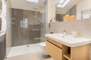 a bathroom with a sink and a shower and a toilet at The Old Weigh House in Kirkby Lonsdale +18 photos