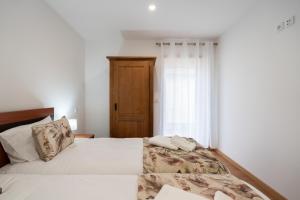 Postel nebo postele na pokoji v ubytování Casa da Petisqueira 54, Paredes-Oporto + 63 fotografií