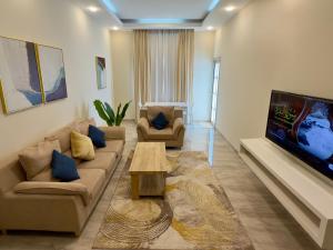 TV a/nebo společenská místnost v ubytování Daar AL Maqam Suites Apartments Salalah